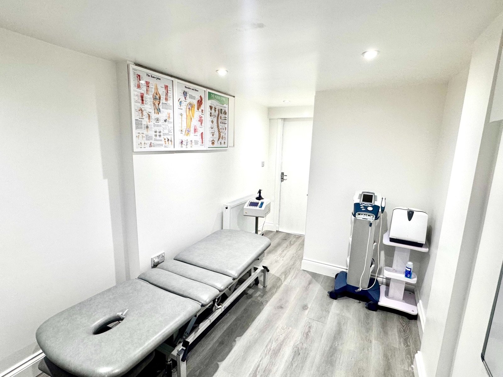Treatment room at P Shinde Physiotherapy in Northampton, with treatment couch and electrotherapy equipment
